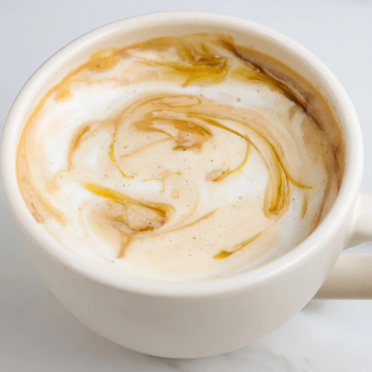 Rich onion latte topped with creamy frothed milk and caramelized onions.  