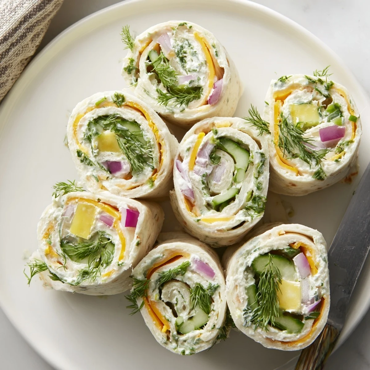 Deliciously rolled Pickle-in-a-Blanket ready for picnics, parties, or quick snacking.
