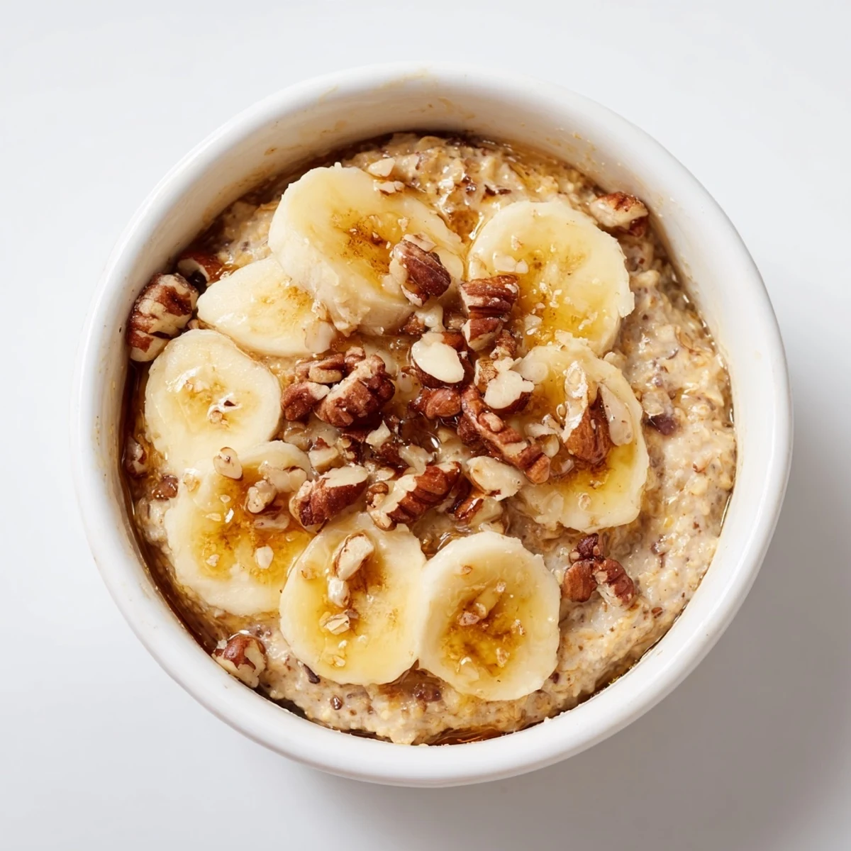 Golden-brown Baked Oats Ramekins with Banana and Honey, a warm American breakfast, ready to serve.