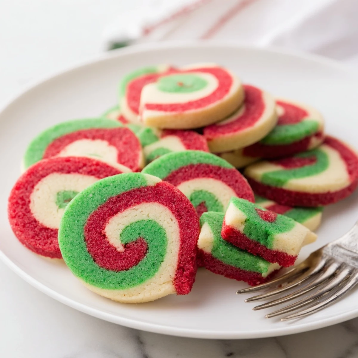 Close-up of baked holiday pinwheel cookies showing the swirls, a delicious, buttery American baking classic.
