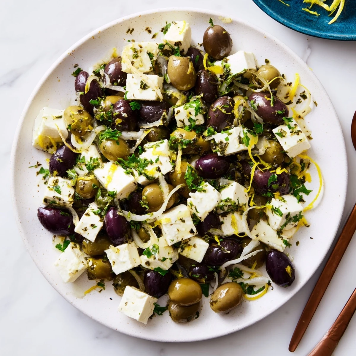 A close-up view of the delicious Holiday Mix, showcasing marinated olives and creamy feta.