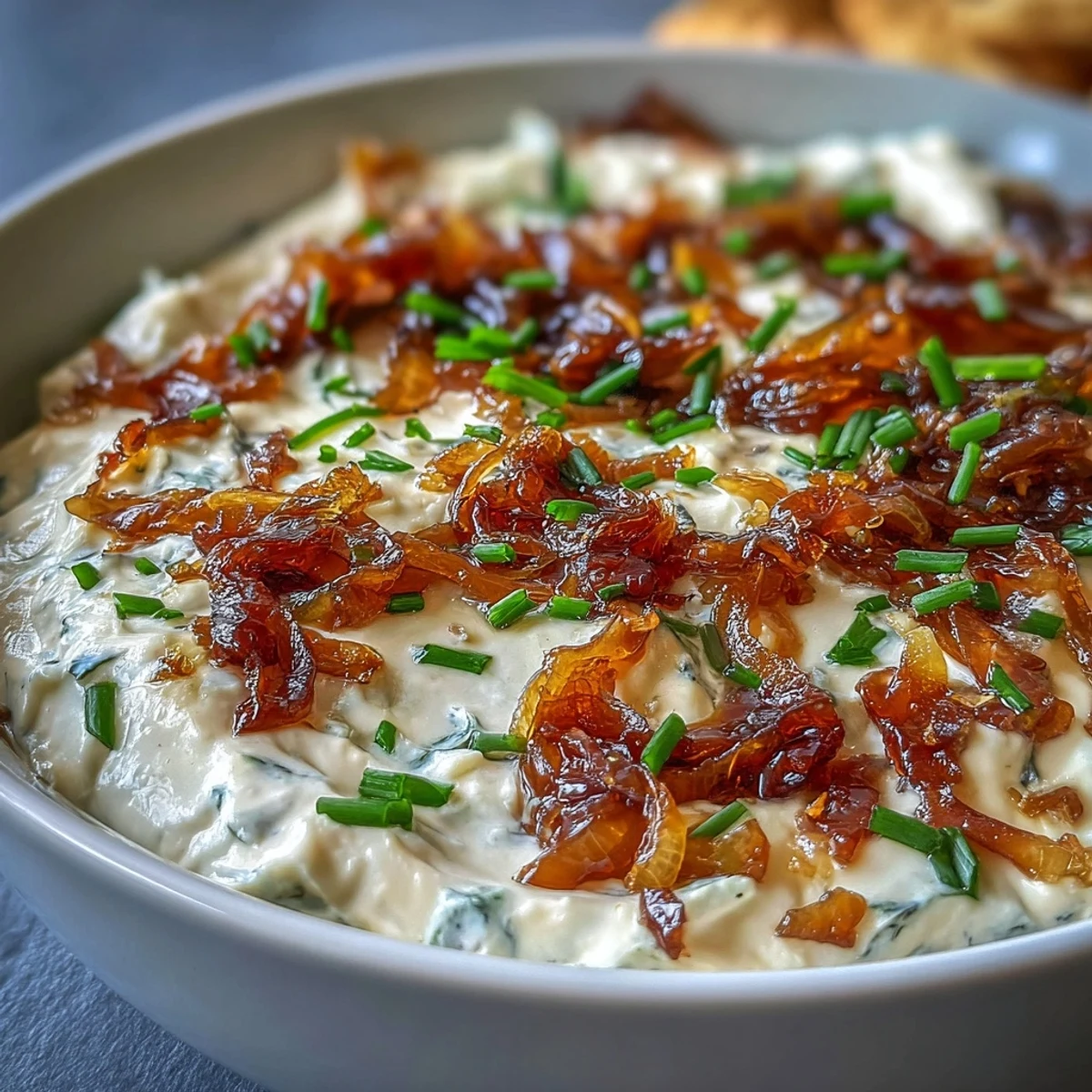 Golden caramelized onions blended into a smooth Greek yogurt dip, perfect for parties or as a sandwich spread.