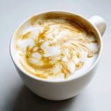 Bold onion latte served in a warm cup, perfect for adventurous coffee lovers.  