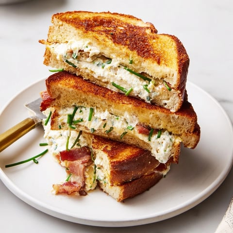 Golden, toasted Ricotta Bacon Breakfast Grilled Cheese, oozing cheese and fragrant with savory bacon.