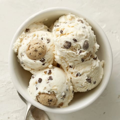 Creamy Cottage Cheese Ice Cream with Cookie Dough sprinkled on top, a delightful treat.  