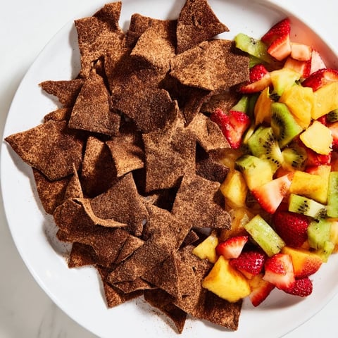 Crispy chocolate tortilla chips served with vibrant fruit salsa for dipping.  