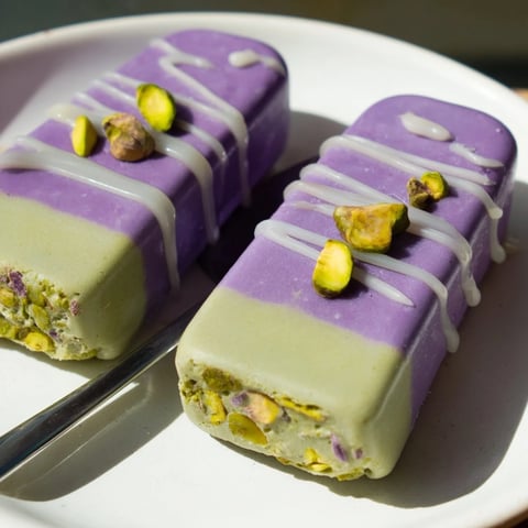 Creamy ube & pistachio ice cream bars, swirled with vibrant colors and flavors.  