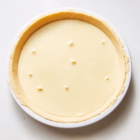 Golden-crusted Water Pie with a creamy, jiggly center, perfect for a budget-friendly dessert.