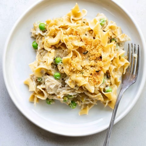 Golden, bubbly Creamy Tuna Noodle Casserole topped with crispy Ritz crackers, perfect family meal.