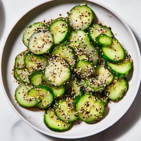 Crisp Cucumber Shaker with everything bagel seasoning glistening, a quick and satisfying snack ready to enjoy.