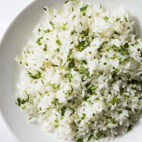 Steaming Cilantro Lime Rice: A vibrant side dish with fresh cilantro and zesty lime flavor.