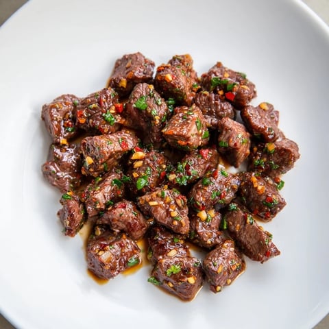 Golden-brown Garlic Butter Steak Bites glistens with a rich, savory, and irresistible sauce.
