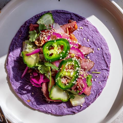 Customizable bowls featuring Global Street-Food Fusion Tacos filled with colorful veggies.  