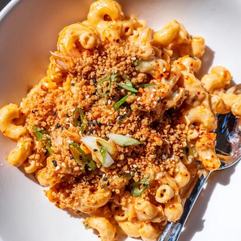 Baked Spicy Kimchi Mac & Cheese, featuring melted cheese and tangy kimchi flavor.  