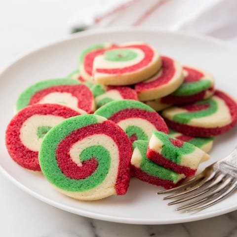 Close-up of baked holiday pinwheel cookies showing the swirls, a delicious, buttery American baking classic.