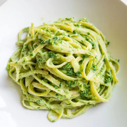 Creamy homemade Green Goddess Pasta Sauce boasts the bright flavors of fresh herbs and garlic.