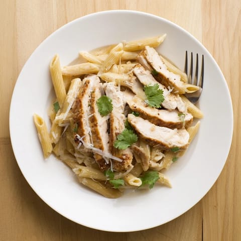 Savory honey chipotle chicken pasta served hot, drizzled with creamy sauce and extra Parmesan.