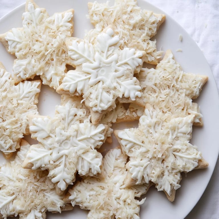 This stunning Snowflake Dessert Board features snowflake cookies, chocolates, and colorful, fresh fruits.