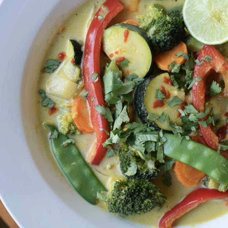 Hearty bowl of Coconut Curry Vegetables, featuring a medley of fresh, tender vegetables in a rich curry.