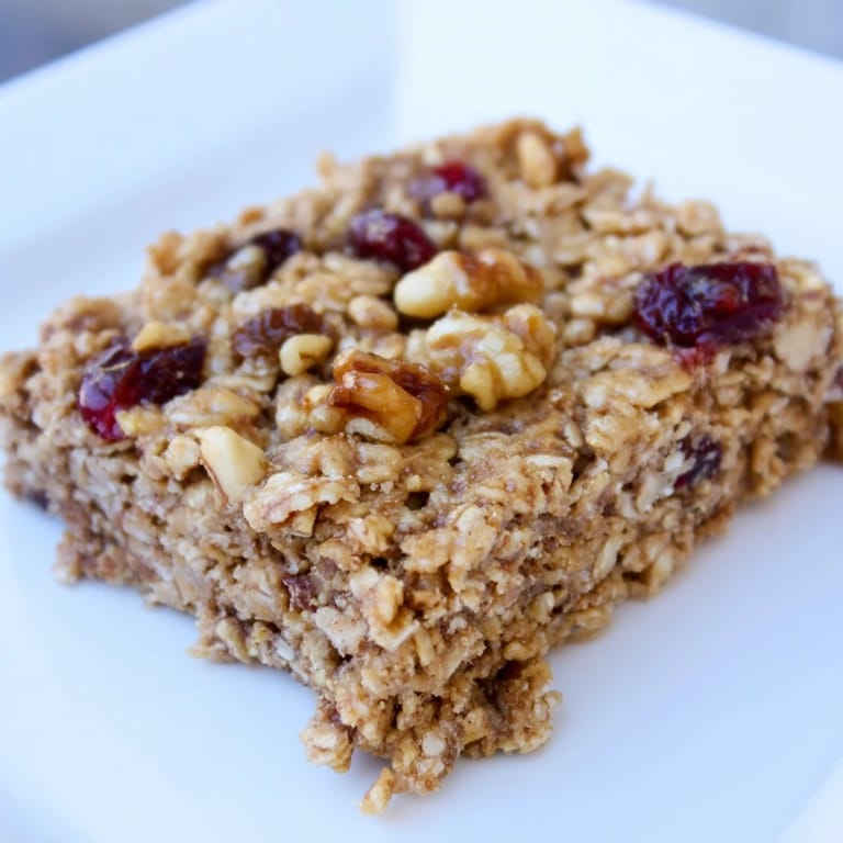 A close-up of sweet Maple Cinnamon Oatmeal Bars, perfect for breakfast or to-go snack cravings.