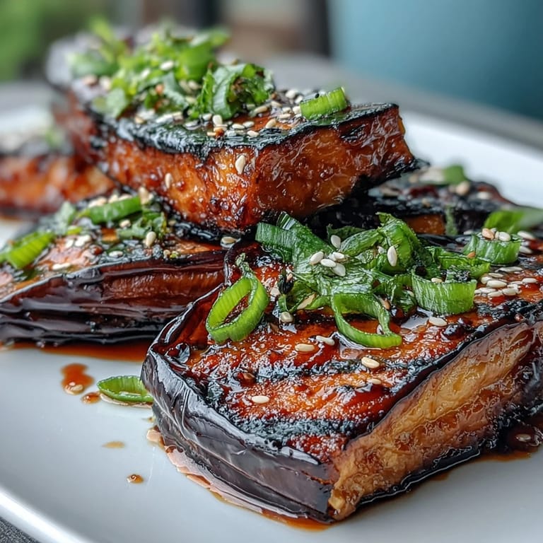 Sweet and savory miso glazed eggplant, caramelized to perfection and served as a flavorful vegetarian side dish with an umami-rich finish.  